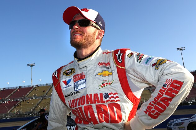 FONTANA, CA - MARCH 21:  Dale Earnhardt Jr., driver of the #88 National Guard Chevrolet, stands on the grid during qualifying for the NASCAR Sprint Cup Series Auto Club 400 at Auto Club Speedway on March 21, 2014 in Fontana, California.  (Photo by Jerry Markland/Getty Images)