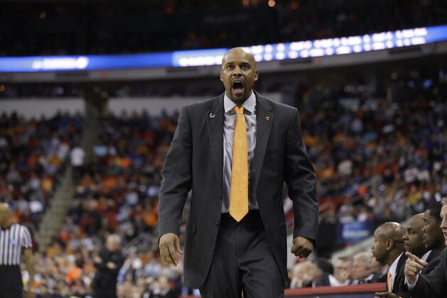 Tennessee head coach Cuonzo Martin speaks to players against Mercer during the second half of an NCAA college basketball third-round tournament game, Sunday, March 23, 2014, in Raleigh. (AP Photo/Gerry Broome)