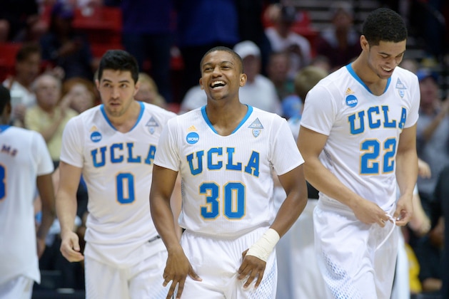 SAN DIEGO, CA - MARCH 23: Aubrey Williams #30 Nick Kazemi #0 and Noah Allen #22 of the UCLA Bruins celebrate their 77 to 60 win over the Stephen F. Austin Lumberjacks during the third round of the 2014 NCAA Men's Basketball Tournament at Viejas Arena on March 23, 2014 in San Diego, California. (Photo by Donald Miralle/Getty Images) SAN DIEGO, CA - MARCH 23: Aubrey Williams #30 Nick Kazemi #0 and Noah Allen #22 of the UCLA Bruins celebrate their 77 to 60 win over the Stephen F. Austin Lumberjacks during the third round of the 2014 NCAA Men's Basketball Tournament at Viejas Arena on March 23, 2014 in San Diego, California. (Photo by Donald Miralle/Getty Images)