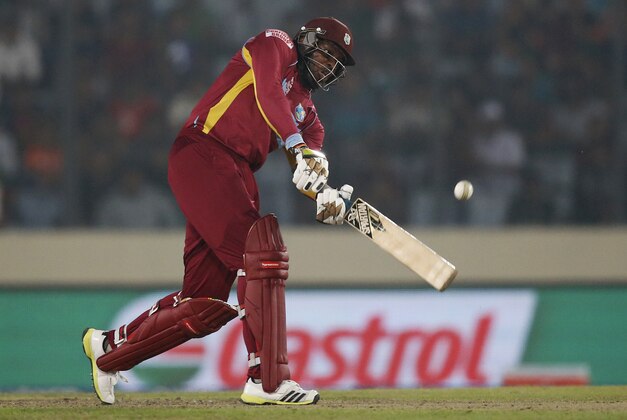 West Indies' batsman Chris Gayle plays a shot during their ICC Twenty20 Cricket World Cup match against Bangladesh in Dhaka, Bangladesh, Tuesday, March 25, 2014. (AP Photo/Aijaz Rahi)