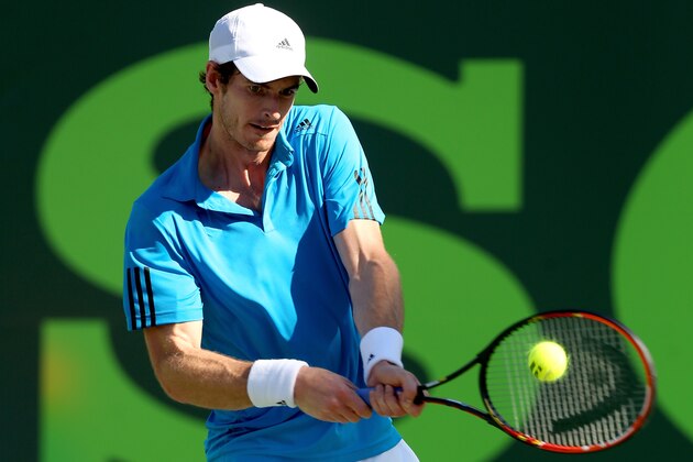 KEY BISCAYNE, FL - MARCH 25:  Andy Murray of Great Britain returns a shot to Jo-Wilfired Tsonga of France during the Sony Open at the Crandon Park Tennis Center on March 25, 2014 in Key Biscayne, Florida.  (Photo by Matthew Stockman/Getty Images)