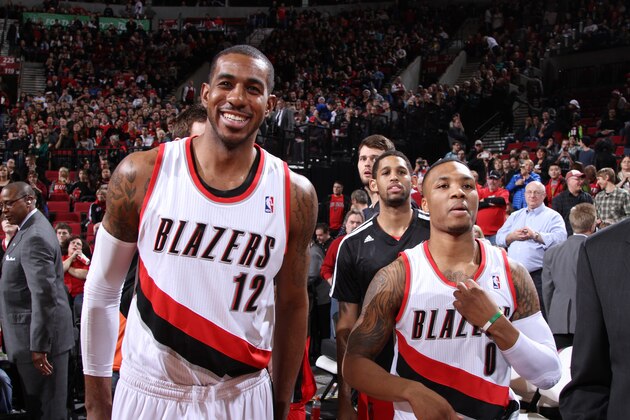 PORTLAND, OR - DECEMBER 21:  Damian Lillard #0 and LaMarcus Aldridge #12 of the Portland Trail Blazers smile after the game against the New Orleans Pelicans on December 21, 2013 at the Moda Center Arena in Portland, Oregon. NOTE TO USER: User expressly acknowledges and agrees that, by downloading and or using this photograph, user is consenting to the terms and conditions of the Getty Images License Agreement. Mandatory Copyright Notice: Copyright 2013 NBAE (Photo by Sam Forencich/NBAE via Getty Images)