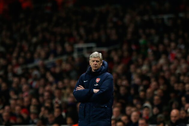 Arsenal's French manager Arsene Wenger stands with his arms folded during the English Premier League soccer match between Arsenal and Swansea City at the Emirates Stadium in London, Tuesday, March 25, 2014. (AP Photo/Matt Dunham) Arsenal's French manager Arsene Wenger stands with his arms folded during the English Premier League soccer match between Arsenal and Swansea City at the Emirates Stadium in London, Tuesday, March 25, 2014. (AP Photo/Matt Dunham)