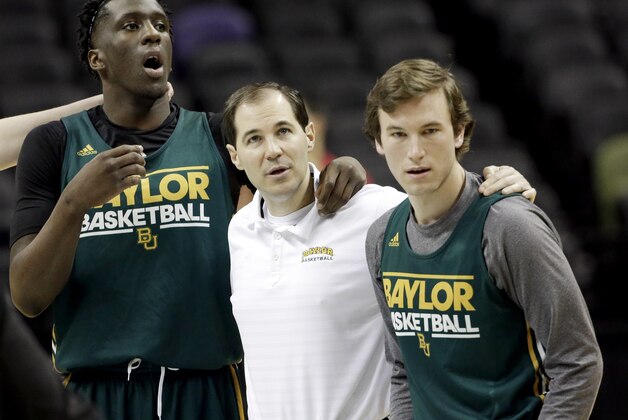 Baylor's Taurean Prince, left, coach Scott Drew, center, and Brady Heslip wait for the rest of the team to join them at center court during practice for the NCAA college basketball tournament in San Antonio, Thursday, March 20, 2014. Baylor plays against Nebraska in a second-round game on Friday. (AP Photo/David J. Phillip) Baylor's Taurean Prince, left, coach Scott Drew, center, and Brady Heslip wait for the rest of the team to join them at center court during practice for the NCAA college basketball tournament in San Antonio, Thursday, March 20, 2014. Baylor plays against Nebraska in a second-round game on Friday. (AP Photo/David J. Phillip)