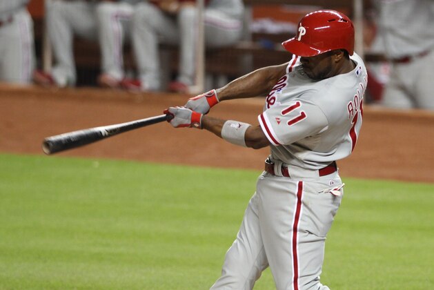MIAMI, FL - SEPTEMBER 24: Jimmy Rollins #11 of the Philadelphia Phillies singles against the Miami Marlins at Marlins Park on September 24, 2013 in Miami, Florida. (Photo by Marc Serota/Getty Images)