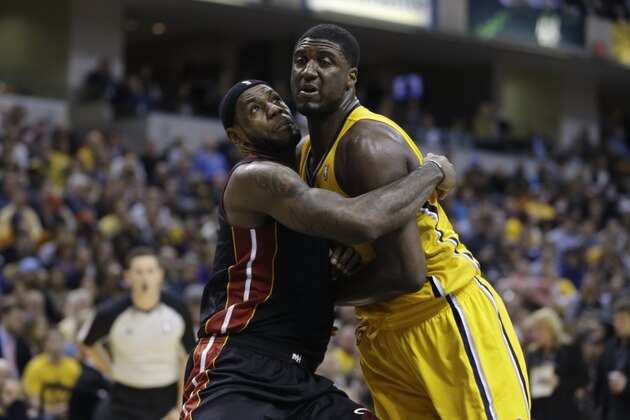 Miami Heat forward LeBron James, left, and Indiana Pacers center Roy Hibbert battle for position on a free throw in the second half of an NBA basketball game in Indianapolis, Tuesday, Dec. 10, 2013. The Pacers defeated the Heat 90-84. (AP Photo/Michael Conroy)