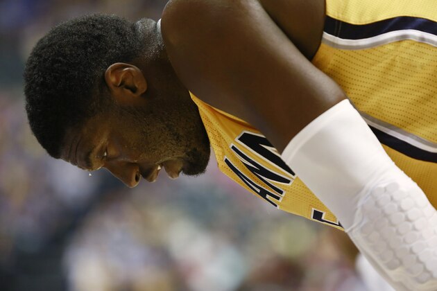 Indiana Pacers center Roy Hibbert leans over while waiting at the free throw line while sweat drips from his forehead, during the first half of an NBA basketball game against the Chicago Bulls in Indianapolis, Friday, March 21, 2014. The Pacers won 91-79. (AP Photo/R Brent Smith)