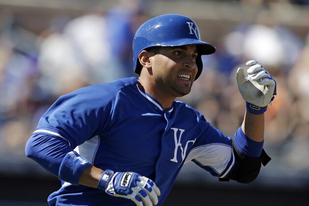 Kansas City Royals' Omar Infante runs after hitting a single during the fifth inning of a spring exhibition baseball game against the San Diego Padres, Sunday, March 16, 2014, in Peoria, Ariz. (AP Photo/Darron Cummings)