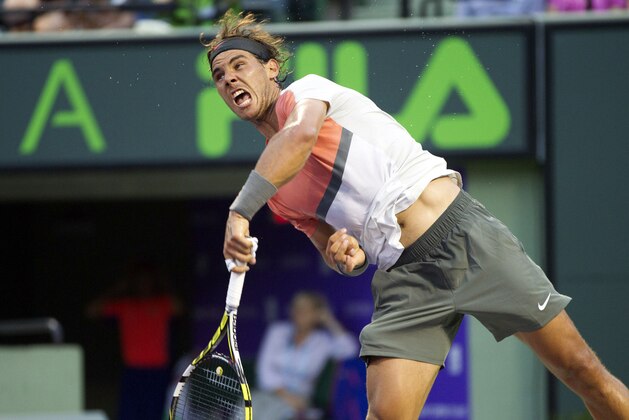 Rafael Nadal, of Spain, returns the ball to Denis Istomin, of Uzbekistan, during the Sony Open Tennis in Key Biscayne, Fla., Monday, March 24, 2014. Nadal won 6-1, 6-0. (AP Photo/J Pat Carter)