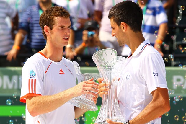 KEY BISCAYNE, FL - APRIL 01: Andy Murray of Great Britain (L) holds the runners up trophy and Novak Djokovic of Serbia poses with the winners trophy after the Men's Finals on Day 14 at Crandon Park Tennis Center at the Sony Ericsson Open on April 1, 2012 in Key Biscayne, Florida. (Photo by Al Bello/Getty Images)