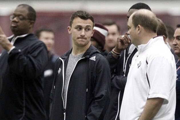 Texas A&M quarterback Johnny Manziel watches the Texas A&M Pro Day held at the McFerrin Athletic Center, Wednesday, March 5, 2014, in College Station, Texas. Manziel did not compete in the Pro Day.  (AP Photo/Patric Schneider)