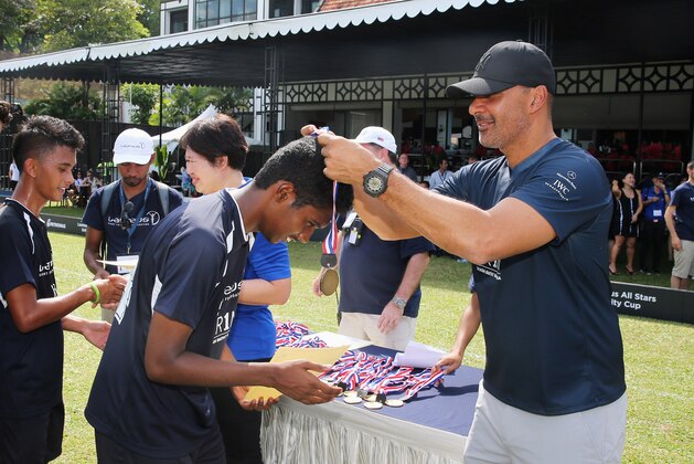 KUALA LUMPUR, MALAYSIA - MARCH 25:  Medals are awarded to the U19 teams by Ruud Gullit and Su Ling, CEO of YR1M during the Laureus All Stars Unity Cup ahead of the 2014 Laureus World Sports Awards at Royal Selangor Club on March 25, 2014 in Kuala Lumpur, Malaysia.  (Photo by Ian Walton/Getty Images for Laureus)