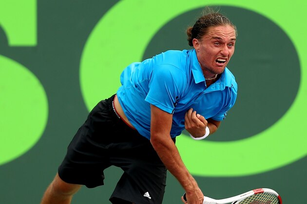 KEY BISCAYNE, FL - MARCH 22: Alexandr Dolgopolov of Russia serves Jarrko Nieminen of Finland during the Sony Open at the Crandon Park Tennis Center on March 22, 2014 in Key Biscayne, Florida.  (Photo by Matthew Stockman/Getty Images)