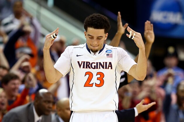RALEIGH, NC - MARCH 23:  London Perrantes #23 of the Virginia Cavaliers reacts after a play in the first half against the Memphis Tigers during the third round of the 2014 NCAA Men's Basketball Tournament at PNC Arena on March 23, 2014 in Raleigh, North Carolina.  (Photo by Streeter Lecka/Getty Images)