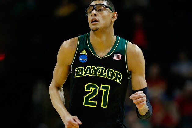 SAN ANTONIO, TX - MARCH 23: Isaiah Austin #21 of the Baylor Bears runs up the floor against the Creighton Bluejays during the third round of the 2014 NCAA Men's Basketball Tournament at the AT&T Center on March 23, 2014 in San Antonio, Texas.  (Photo by Tom Pennington/Getty Images)