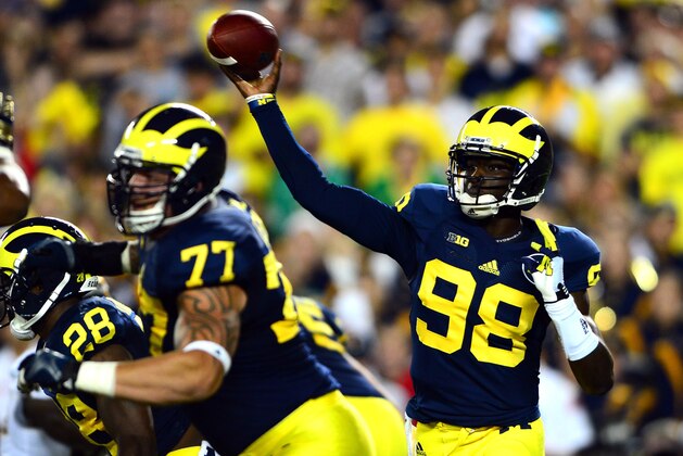 Sep 7, 2013; Ann Arbor, MI, USA; Michigan Wolverines quarterback Devin Gardner throws a pass during the first quarter against the Notre Dame Fighting Irish at Michigan Stadium. Mandatory Credit: Andrew Weber-USA TODAY Sports