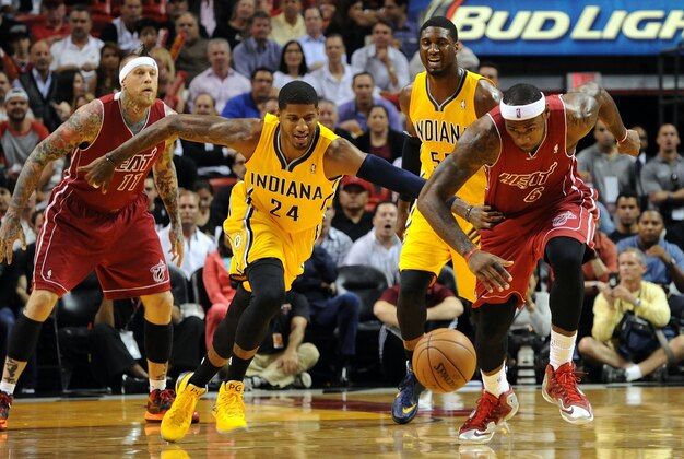 Dec 18, 2013; Miami, FL, USA; Miami Heat small forward LeBron James (6) and Indiana Pacers small forward Paul George (24) both chase a loose ball during the first half at American Airlines Arena. Mandatory Credit: Steve Mitchell-USA TODAY Sports