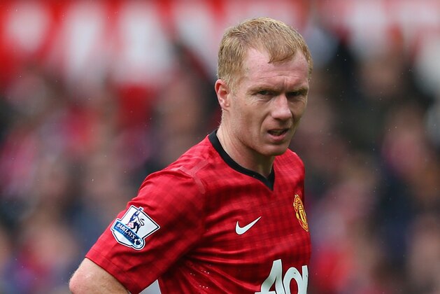 MANCHESTER, ENGLAND - MAY 12:  Paul Scholes of Manchester United looks on during the Barclays Premier League match between Manchester United and Swansea City at Old Trafford on May 12, 2013 in Manchester, England.  (Photo by Alex Livesey/Getty Images)
