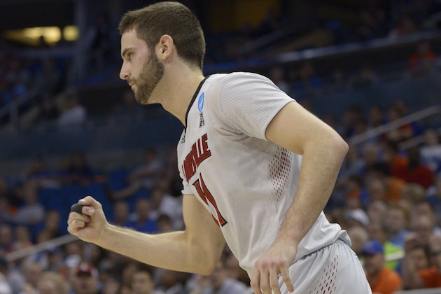 Louisville forward Luke Hancock (11) celebrates a three-point shot during the second half in a third-round game in the NCAA college basketball tournament against Saint Louis, Saturday, March 22, 2014, in Orlando, Fla. (AP Photo/Phelan M. Ebenhack)