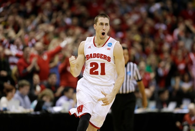 Mar 22, 2014; Milwaukee, WI, USA; Wisconsin Badgers guard Josh Gasser (21) celebrates a 3-point shot in the second half of a men's college basketball game against the Oregon Ducks during the third round of the 2014 NCAA Tournament at BMO Harris Bradley Center. Mandatory Credit: Jeff Hanisch-USA TODAY Sports