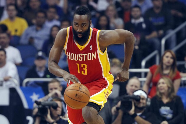 Mar 5, 2014; Orlando, FL, USA; Houston Rockets shooting guard James Harden (13) drives to the basket against the Orlando Magic during the first quarter at Amway Center. Mandatory Credit: Kim Klement-USA TODAY Sports