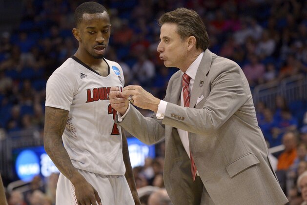 Louisville coach Rick Pitino yells at Louisville guard Russ Smith (2) during the second half in a third-round game in the NCAA college basketball tournament against Saint Louis,  Saturday, March 22, 2014, in Orlando, Fla. (AP Photo/Phelan M. Ebenhack)