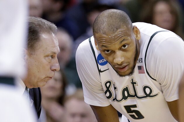 Michigan State's Adreian Payne right, talks with head coach Tom Izzo against Harvard in the second half during the third round of the NCAA men's college basketball tournament in Spokane, Wash., Saturday, March 22, 2014. (AP Photo/Elaine Thompson)