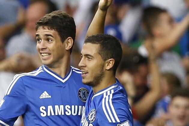 Chelsea's Eden Hazard, right, celebrates scoring a goal with Oscar during the English Premier League soccer match between Chelsea and Aston Villa at Stamford Bridge Stadium in London, Wednesday, Aug. 21, 2013. (AP Photo/Kirsty Wigglesworth)