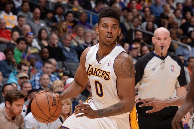 LOS ANGELES, CA - MARCH 23: Nick Young #0 of the Los Angeles Lakers handles the ball during a game against the Orlando Magic at Staples Center on March 23, 2014 in Los Angeles, California. NOTE TO USER: User expressly acknowledges and agrees that, by downloading and/or using this Photograph, user is consenting to the terms and conditions of the Getty Images License Agreement. Mandatory Copyright Notice: Copyright 2014 NBAE (Photo by Andrew D. Bernstein/NBAE via Getty Images)