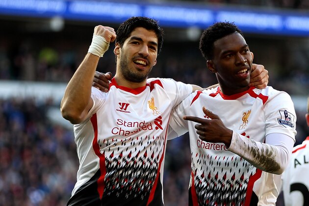 CARDIFF, WALES - MARCH 22:  Daniel Sturridge of Liverpool celebrates with team mate Luis Suarez after scoring his team's fifth goal during the Barclays Premier League match between Cardiff City and Liverpool at Cardiff City Stadium on March 22, 2014 in Cardiff, Wales.  (Photo by Ben Hoskins/Getty Images)