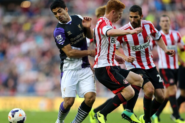 Liverpool's Luis Suarez, left, clashes with Sunderland's Jack Colback, right, during their English Premier League soccer match at the Stadium of Light, Sunderland, England, Sunday, Sept. 29, 2013. (AP Photo/Scott Heppell) Liverpool's Luis Suarez, left, clashes with Sunderland's Jack Colback, right, during their English Premier League soccer match at the Stadium of Light, Sunderland, England, Sunday, Sept. 29, 2013. (AP Photo/Scott Heppell)