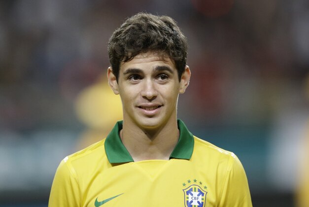 Brazil's Oscar lines up before their friendly soccer match against South Korea at Seoul World Cup Stadium in Seoul, South Korea, Saturday, Oct.12, 2013. (AP Photo/Lee Jin-man)