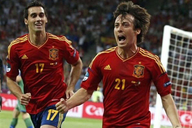 Spain's David Silva, right, celebrates flanked by his teammate Alvaro Arbeloa after scoring during the Euro 2012 soccer championship final between Spain and Italy in Kiev, Ukraine, Sunday, July 1, 2012. (AP Photo/Jon Super) Spain's David Silva, right, celebrates flanked by his teammate Alvaro Arbeloa after scoring during the Euro 2012 soccer championship final between Spain and Italy in Kiev, Ukraine, Sunday, July 1, 2012. (AP Photo/Jon Super)