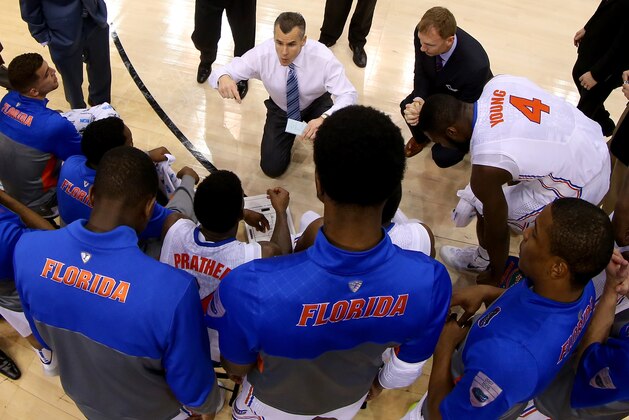 ORLANDO, FL - MARCH 22:  Head coach Billy Donovan of the Florida Gators talks with his team as they huddle while taking on the Pittsburgh Panthers during the third round of the 2014 NCAA Men's Basketball Tournament at Amway Center on March 22, 2014 in Orlando, Florida.  (Photo by Mike Ehrmann/Getty Images)