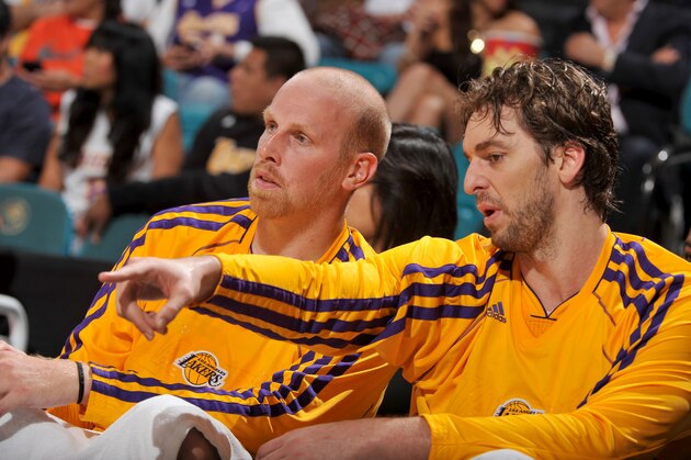 LAS VEGAS, NEVADA - OCTOBER 10:  Chris Kaman #9 and Pau Gasol #16 of the Los Angeles Lakers discus a play during the game against the Sacramento Kings at the MGM Grand Garden Arena on October 10, 2013 in Las Vegas, Nevada. NOTE TO USER: User expressly acknowledges and agrees that, by downloading and/or using this Photograph, user is consenting to the terms and conditions of the Getty Images License Agreement. Mandatory Copyright Notice: Copyright 2013 NBAE (Photo by Garrett W. Ellwood/NBAE via Getty Images)