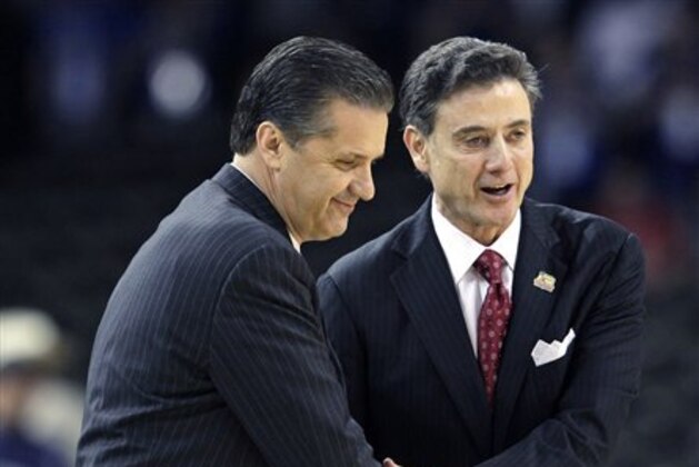 FILE - in this March 31, 2012, file photo,  Louisville head coach Rick Pitino, right, shakes hands with Kentucky head coach John Calipari before the first half of an NCAA Final Four semifinal college basketball tournament game in New Orleans. Kentucky has fallen out of the Top 25 and the defending national champs are still looking to establish themselves heading into the instate showdown with rival Louisville. The fourth-ranked Cardinals Saturday will try to end a four-game skid against the Wildcats. (AP Photo/David J. Phillip, File)
