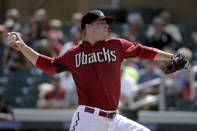 Arizona Diamondbacks starting pitcher Archie Bradley throws to the Seattle Mariners during the first inning of a spring exhibition baseball game in Scottsdale, Ariz., Thursday, March 13, 2014. (AP Photo/Chris Carlson)