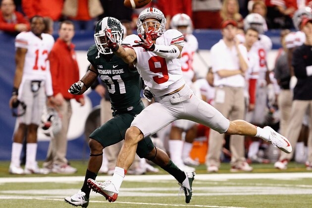 INDIANAPOLIS, IN - DECEMBER 07: Devin Smith #9 of the Ohio State Buckeyes can't come up with a fourth quarter pass in front of Darqueze Dennard #31 of the Michigan State Spartans during the Big 10 Conference Championship Game at Lucas Oil Stadium on December 7, 2013 in Indianapolis, Indiana. Michigan State won the game 34-24. (Photo by Gregory Shamus/Getty Images)