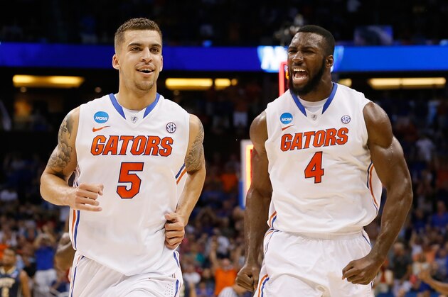 ORLANDO, FL - MARCH 22: Scottie Wilbekin #5 and Patric Young #4 of the Florida Gators celebrate after Wilbekin makes a three-pointer to end the first half against the Pittsburgh Panthers during the third round of the 2014 NCAA Men's Basketball Tournament at Amway Center on March 22, 2014 in Orlando, Florida. (Photo by Kevin C. Cox/Getty Images) ORLANDO, FL - MARCH 22: Scottie Wilbekin #5 and Patric Young #4 of the Florida Gators celebrate after Wilbekin makes a three-pointer to end the first half against the Pittsburgh Panthers during the third round of the 2014 NCAA Men's Basketball Tournament at Amway Center on March 22, 2014 in Orlando, Florida. (Photo by Kevin C. Cox/Getty Images)