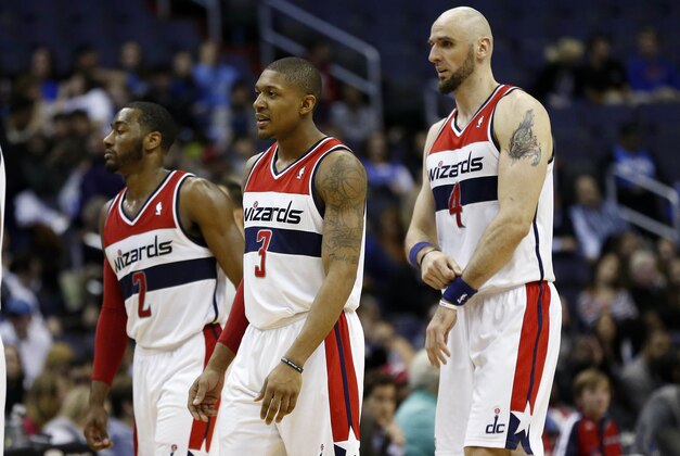 Feb 25, 2014; Washington, DC, USA; Washington Wizards point guard John Wall (2), Wizards shooting guard Bradley Beal (3), and Wizards center Marcin Gortat (4) walk off the court during a stoppage in play against the Orlando Magic in the fourth quarter at Verizon Center. The Wizards won 115-106. Mandatory Credit: Geoff Burke-USA TODAY Sports
