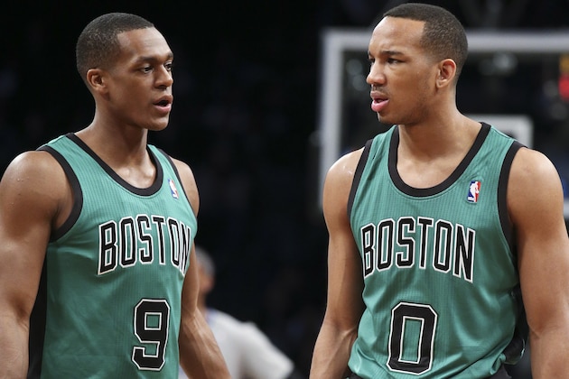 Boston Celtics guard Rajon Rondo (9) and guard Avery Bradley (0) wait for play to resume during the first half of an NBA basketball game against the Brooklyn Nets at the Barclays Center, Friday, March 21, 2014, in New York. The Nets defeated the Celtics, 114-98. (AP Photo/John Minchillo)