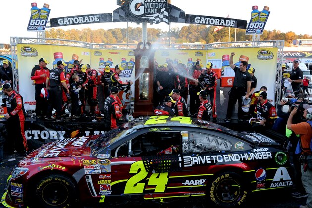 MARTINSVILLE, VA - OCTOBER 27:  Jeff Gordon, driver of the #24 Drive To End Hunger Chevrolet, and his team celebrate in victory lane after winning the NASCAR Sprint Cup Series Goody's Headache Relief Shot 500 Powered By Kroger at Martinsville Speedway on October 27, 2013 in Martinsville, Virginia.  (Photo by Jerry Markland/Getty Images)