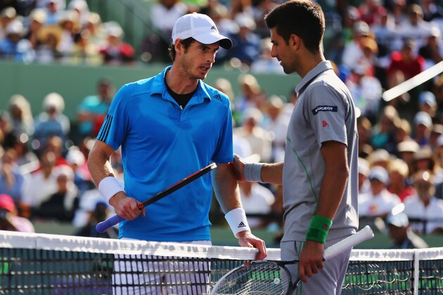 KEY BISCAYNE, FL - MARCH 26:  Andy Murray of Great Britain and Novak Djokovic of Serbia discuss whether Djokovic's raquet touched the net during a point during their match on day 10 of the Sony Open at Crandon Park Tennis Center on March 26, 2014 in Key Biscayne, Florida.  (Photo by Al Bello/Getty Images)