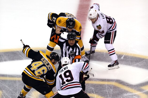 BOSTON, MA - JUNE 19: David Krejci #46 of the Boston Bruins and Jonathan Toews #19 of the Chicago Blackhawks face off to start Game Four of the 2013 NHL Stanley Cup Final at TD Garden on June 19, 2013 in Boston, Massachusetts.  (Photo by Bruce Bennett/Getty Images)