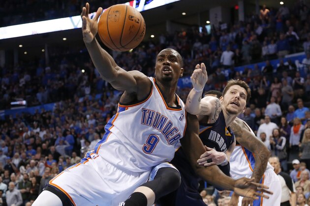 Oklahoma City Thunder forward Serge Ibaka (9) grabs a rebound in front of Memphis Grizzlies forwrd Mike Miller (13) during the fourth quarter of an NBA basketball game in Oklahoma City, Friday, Feb. 28, 2014. Oklahoma City won 113-107. (AP Photo/Sue Ogrocki)