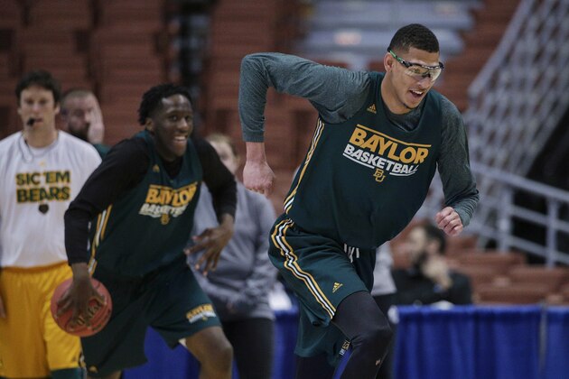 Baylor's Isaiah Austin runs on the court during practice at the NCAA college basketball tournament Wednesday, March 26, 2014, in Anaheim, Calif. Baylor plays Wisconsin in a regional semifinal on Thursday. (AP Photo/Jae C. Hong)