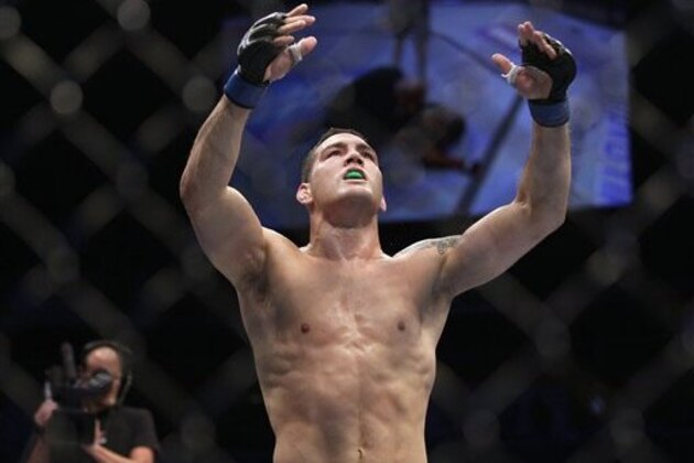 Chris Weidman celebrates after beating Mark Munoz in a UFC on Fuel 4 Mixed Martial Arts middleweight bout in San Jose, Calif., Wednesday, July 11, 2012. Weidman won in the second round. (AP Photo/Jeff Chiu)