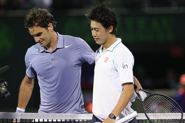 KEY BISCAYNE, FL - MARCH 26:  Roger Federer of Switzerland at the net after his three set defeat congratulates  Kei Nishikori of Japan during their quarter final round match during day 10 at the Sony Open at Crandon Park Tennis Center on March 26, 2014 in Key Biscayne, Florida.  (Photo by Clive Brunskill/Getty Images)