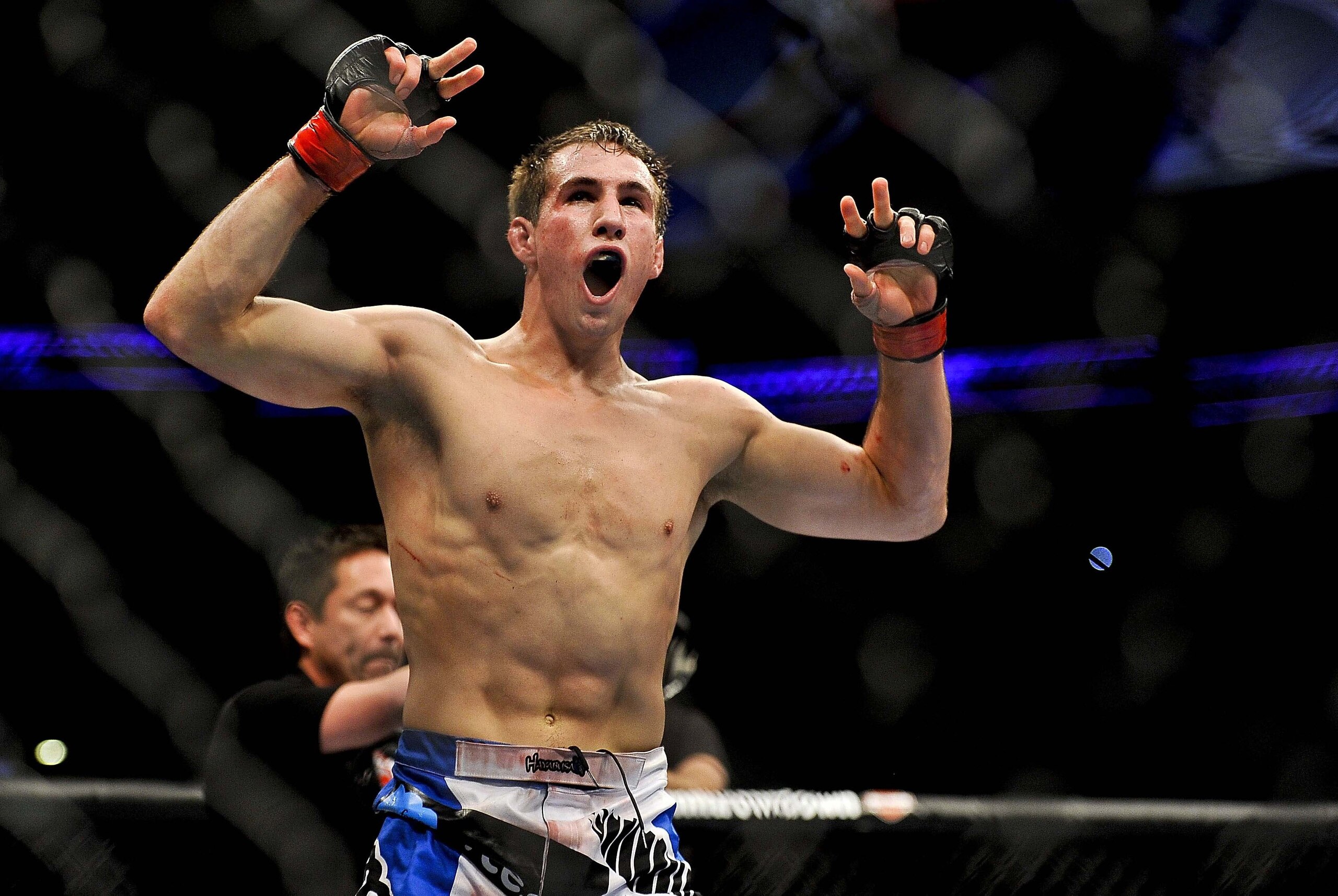 Apr 21, 2012; Atlanta, GA, USA; Rory MacDonald celebrates beating Chad Mills in a welterweight bout during UFC 145 at Philips Arena. MacDonald won the bout by technical knock out. Mandatory Credit: Paul Abell-USA TODAY Sports