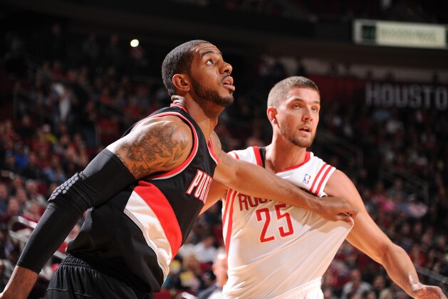 HOUSTON, TX - MARCH 9:  Chandler Parsons #25 of the Houston Rockets battles for position against LaMarcus Aldridge #12 of the Portland Trail Blazers on March 9, 2014 at the Toyota Center in Houston, Texas. NOTE TO USER: User expressly acknowledges and agrees that, by downloading and or using this photograph, User is consenting to the terms and conditions of the Getty Images License Agreement. Mandatory Copyright Notice: Copyright 2014 NBAE (Photo by Bill Baptist/NBAE via Getty Images)